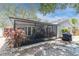 Enjoy outdoor living on the screened patio, complemented by a landscaped backyard and paved patio at 1428 Chesterfield Dr, Dunedin, FL 34698