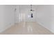 Open living room featuring tiled floors and ample natural light at 14926 Feather Cove Rd, Clearwater, FL 33762