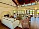 Bright living room with high ceilings, fireplace, and views of the lake at 14926 Feather Cove Rd, Clearwater, FL 33762