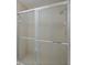 Close-up of tiled shower with a sliding glass door at 14926 Feather Cove Rd, Clearwater, FL 33762
