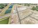 Aerial view of neighborhood street layout and surrounding ponds and planned home locations at 15055 Zircon Red Dr, Wimauma, FL 33598