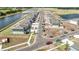 Aerial view of neighborhood under construction with roads, ponds, and newly built homes at 15055 Zircon Red Dr, Wimauma, FL 33598