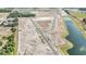 Aerial view of neighborhood layout with street and lot outlines next to several ponds at 15055 Zircon Red Dr, Wimauma, FL 33598