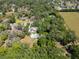 Aerial view of the property showcasing the surrounding trees and the home's location at 1603 Cottagewood Dr, Brandon, FL 33510