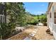 Backyard featuring mature trees, offering plenty of space and privacy at 1603 Cottagewood Dr, Brandon, FL 33510