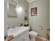 Traditional bathroom with white tiled sink and decorative mirror at 1603 Cottagewood Dr, Brandon, FL 33510
