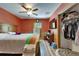 Bedroom with wainscotting, closet, and ceiling fan at 1603 Cottagewood Dr, Brandon, FL 33510