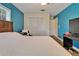 Bedroom featuring a closet, neutral walls, and light-colored laminate flooring at 1603 Cottagewood Dr, Brandon, FL 33510