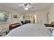 Bedroom with ceiling fan, carpet flooring, and natural light at 1603 Cottagewood Dr, Brandon, FL 33510