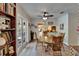 Bright dining room with hardwood floors, French doors, and a view into the kitchen at 1603 Cottagewood Dr, Brandon, FL 33510