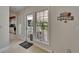 Welcoming entryway with natural light, tiled flooring, and a view of the outdoor porch at 1603 Cottagewood Dr, Brandon, FL 33510