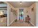 Charming foyer with brick flooring, decorative accents, and a view into the home's living spaces at 1603 Cottagewood Dr, Brandon, FL 33510