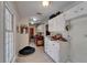 Functional laundry room with ample storage, countertop space, and a modern washer and dryer at 1603 Cottagewood Dr, Brandon, FL 33510