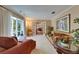 Comfortable living room with a bay window, plush seating, and classic decor offers an inviting retreat at 1603 Cottagewood Dr, Brandon, FL 33510