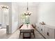 Elegant dining room featuring a chandelier, natural light, and space for hosting dinner parties at 17206 Emerald Chase Dr, Tampa, FL 33647