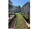 Backyard with a garden and fence provides a private oasis, ideal for gardening and relaxation at 1748 Ragland Ave, Clearwater, FL 33765