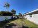 Large backyard with new landscaping and modern white fence at 1748 Ragland Ave, Clearwater, FL 33765