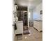 A neutral bathroom featuring a glass shower, white vanity, and tan-colored tile floors at 1748 Ragland Ave, Clearwater, FL 33765