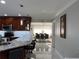 Open floor plan featuring a modern kitchen, spacious dining area, and white marble floors at 1748 Ragland Ave, Clearwater, FL 33765