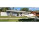 Well-maintained single-story home featuring a manicured lawn and charming curb appeal at 1748 Ragland Ave, Clearwater, FL 33765