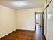 Cozy bedroom featuring wood-look flooring and an attached closet at 2331 Finlandia Ln # 73, Clearwater, FL 33763