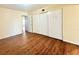 Spacious bedroom offering wood-look flooring and a double sliding door closet at 2331 Finlandia Ln # 73, Clearwater, FL 33763
