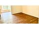 This bedroom has wood-look flooring and natural light with large windows at 2331 Finlandia Ln # 73, Clearwater, FL 33763