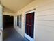 Inviting condo entrance with stylish door, decorative bars, and clear unit number at 2331 Finlandia Ln # 73, Clearwater, FL 33763