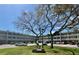 Charming condo building with lush landscaping and ample parking for residents and guests at 2331 Finlandia Ln # 73, Clearwater, FL 33763