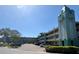 Aloha tower condo complex with parking, featuring a distinctive architectural style at 2331 Finlandia Ln # 73, Clearwater, FL 33763