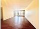 Spacious living room featuring wood floors and natural light, creating a warm and inviting atmosphere at 2331 Finlandia Ln # 73, Clearwater, FL 33763