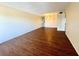 Bright living room with sleek wood floors and neutral walls, perfect for modern living at 2331 Finlandia Ln # 73, Clearwater, FL 33763