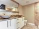 Bathroom featuring double vessel sinks on granite countertop and decorative mirror at 2700 Cove Cay Dr # 1-2D, Clearwater, FL 33760