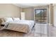 Bright bedroom with a sliding glass door and a view of the golf course at 2700 Cove Cay Dr # 1-2D, Clearwater, FL 33760
