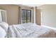 Bright bedroom featuring a sliding glass door with a golf course view at 2700 Cove Cay Dr # 1-2D, Clearwater, FL 33760
