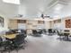 Spacious community room offering tables, chairs and lots of natural lighting at 2700 Cove Cay Dr # 1-2D, Clearwater, FL 33760