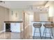 Bright kitchen area featuring a wine cooler, granite countertops and barstool seating at 2700 Cove Cay Dr # 1-2D, Clearwater, FL 33760