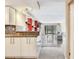 Kitchen opens to the living room with tile floors and a window view at 2700 Cove Cay Dr # 1-2D, Clearwater, FL 33760
