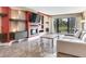 Bright and spacious living room with marble floors, modern fireplace, and sliding glass doors at 2700 Cove Cay Dr # 1-2D, Clearwater, FL 33760
