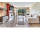 Bright and spacious living room with marble floors, modern fireplace, and sliding glass doors at 2700 Cove Cay Dr # 1-2D, Clearwater, FL 33760