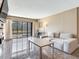 Bright and open living room with access to an outdoor balcony, perfect for entertaining guests at 2700 Cove Cay Dr # 1-2D, Clearwater, FL 33760