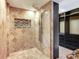 Bathroom featuring tile shower with frameless glass surround and built-in niche at 2700 Cove Cay Dr # 1-2D, Clearwater, FL 33760