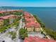 Beautiful aerial view of condos by the bay, highlighted by lush landscaping and ample parking at 2739 Via Capri # 1024, Clearwater, FL 33764