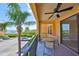 Relaxing balcony with seating and a view of the surrounding landscape at 2739 Via Capri # 1024, Clearwater, FL 33764
