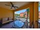Balcony with seating, ceiling fan, and building views, offers a comfortable outdoor retreat at 2739 Via Capri # 1024, Clearwater, FL 33764
