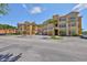Attractive Mediterranean-style condo building offering garages and lush tropical landscaping at 2739 Via Capri # 1024, Clearwater, FL 33764