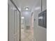 Hallway featuring tile floors and white doors at 2739 Via Capri # 1024, Clearwater, FL 33764