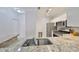 Kitchen featuring stainless steel appliances, granite countertops, and white cabinets at 2739 Via Capri # 1024, Clearwater, FL 33764