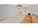 Open living area with tile flooring and a view of the kitchen bar and lighting at 2739 Via Capri # 1024, Clearwater, FL 33764