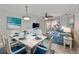 Bright living room features coastal decor, tile floors and a sliding door leading to an outdoor patio at 2739 Via Capri # 1024, Clearwater, FL 33764
